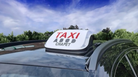 Plaque TAXI ABCD à Chapet sur le toit du véhicule